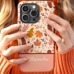 Botanical Fall Floral Leaves Script Name iPhone 15 Case<br><div class="desc">Embrace the beauty of autumn with this charming design featuring a pattern of botanical fall leaves and florals. The warm tones of orange, brown, and beige create a cozy and seasonal look, perfect for fall enthusiasts. The script name element adds a personalized and elegant touch, making this design both stylish...</div>