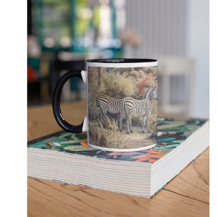 Botanical scene of zebras and lions in an oasis mug
