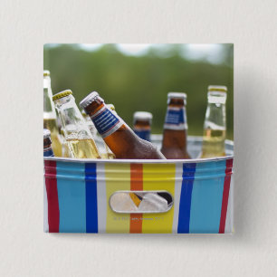 Bottles of beer in ice bucket 2 inch square button