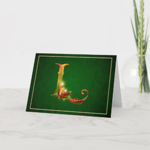 Bougies allumées rougeoyantes L initial de carte