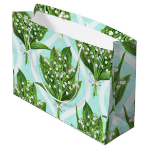 Bouquet of lilly of the valley flowers on blue large gift bag