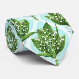 Bouquet of lilly of the valley flowers on blue tie