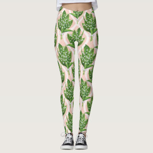 Bouquet of lilly of the valley flowers on green leggings