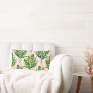 Bouquet of lilly of the valley flowers on green lumbar pillow