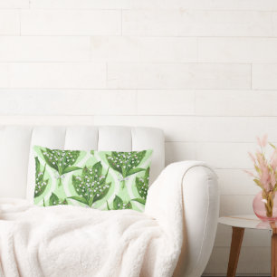 Bouquet of lilly of the valley flowers on green lumbar pillow