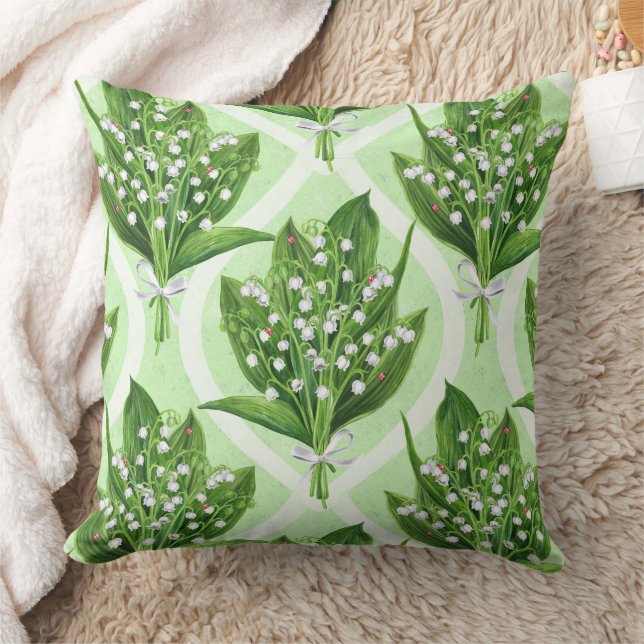 Bouquet of lilly of the valley flowers on green throw pillow (Blanket)