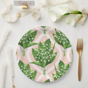 Bouquet of lilly of the valley flowers on pink paper plate