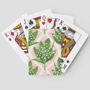 Bouquet of lilly of the valley flowers on pink playing cards