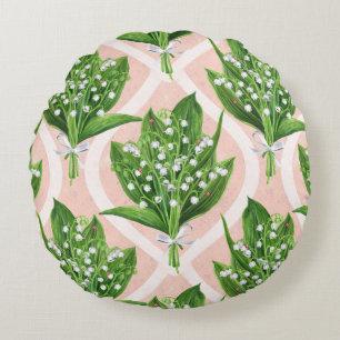 Bouquet of lilly of the valley flowers on pink round pillow