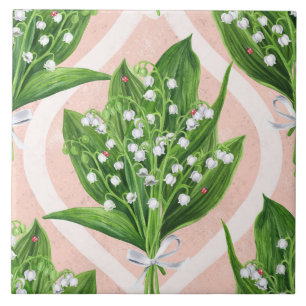 Bouquet of lilly of the valley flowers on pink tile