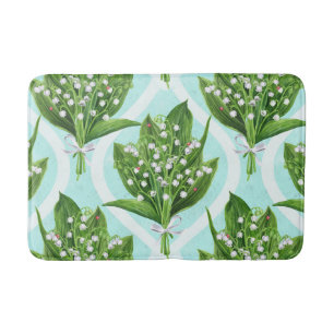 Bouquet of lily of the valley flowers on blue bath mat