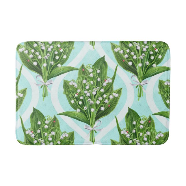 Bouquet of lily of the valley flowers on blue bath mat (Front)