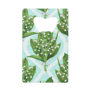 Bouquet of lily of the valley flowers on blue credit card bottle opener