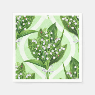 Bouquet of lily of the valley flowers on blue napkin