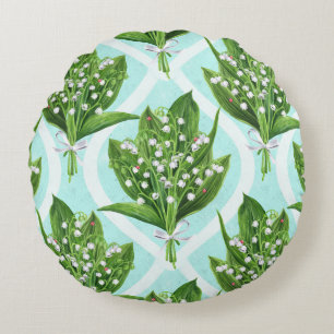Bouquet of lily of the valley flowers on blue round pillow