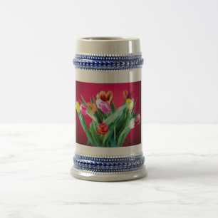 Bouquet of tulips on red beer stein