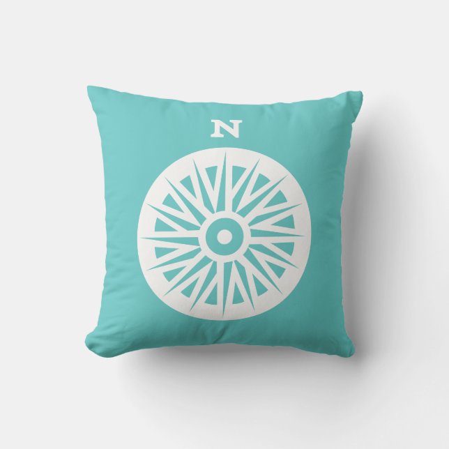 boussole blanche sur coussin bleu turquoise (Recto)