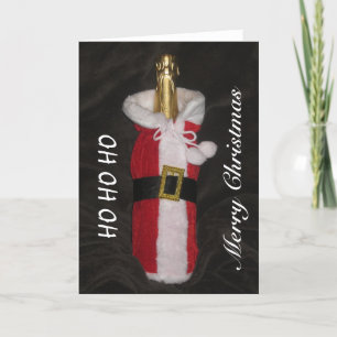 Bouteille de vin dans la carte de Joyeux Noël de