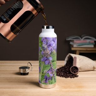 Bouteille D'eau Bleu-Eyed Denton sur les fleurs violettes