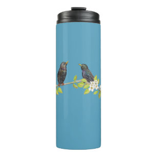 Bouteilles Isothermes Deux Starlings dans une succursale florissante au
