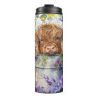 Fleurs violettes avec vache des Highlands