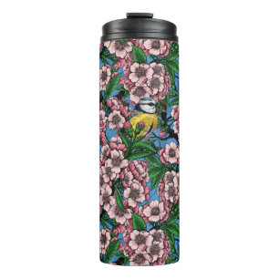 Bouteilles Isothermes Rameaux bleus dans le cerisier en fleurs sur le bl