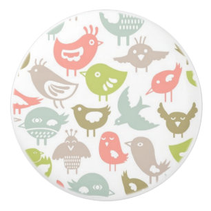 Bouton De Porte En Céramique arrière - plan avec l'ornement coloré d'oiseaux