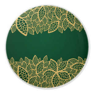 Bouton De Porte En Céramique Dentelle d'or de feuille sur l'arrière - plan vert