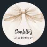 Bow beige cream birthday classic round sticker<br><div class="desc">A beige,  cream coloured background. Decorated with a large bow.  Personalize and add a name and age. Black handwritten style script.</div>