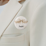 Bow beige cream name tag 2 inch round button<br><div class="desc">A beige,  cream coloured background. Decorated with a large bow.  Personalize and add your name.   Black handwritten style script.</div>