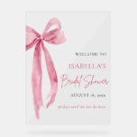 Bow She's Tying the Knot Bridal Shower Welcome Acrylic Sign<br><div class="desc">Welcome your guests in style with our Pink Bow She's Tying the Knot Bridal Shower Welcome Poster. Adorned with a charming pink bow design, this poster sets the tone for a memorable celebration. Guide your guests to the festivities and create a warm atmosphere from the moment they arrive. Let this...</div>