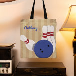 Bowling Ball and Pins Personalized Tote Bag<br><div class="desc">Create a personalized gift for your favourite bowler when you add their name to this tote bag. The front of the bag has a realistic style illustration of a bowling ball and bowling pins set against a tan striped background with a spot to add a name in blue script lettering....</div>