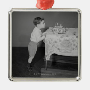 Boy Blowing Out Candles Metal Ornament