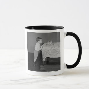 Boy Blowing Out Candles Mug