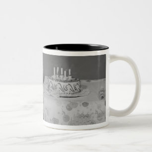 Boy Blowing Out Candles Two-Tone Coffee Mug