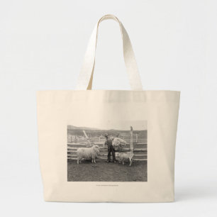 Boy holding up a bundle of wool large tote bag