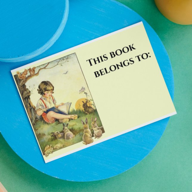 Boy reading under tree with rabbits sticker (Creator Uploaded)