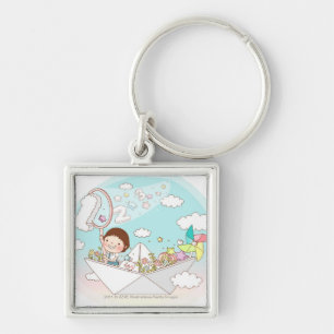 Boy sitting in paper boat keychain