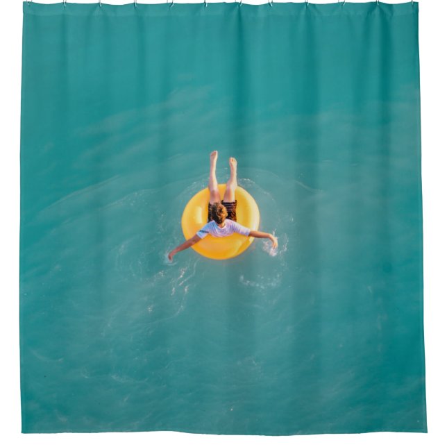 Boy sitting on buoy (Front)