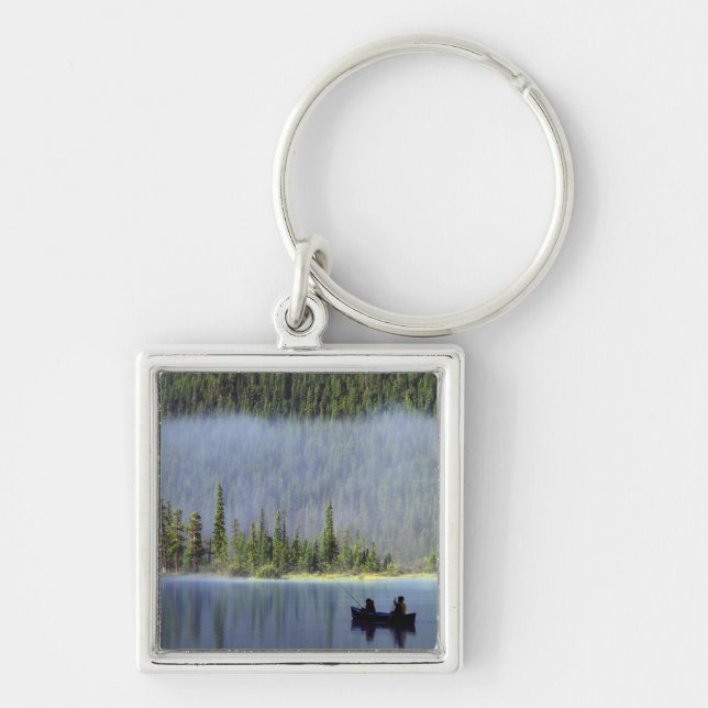 Boys fishing from canoe with mist in keychain (Front)