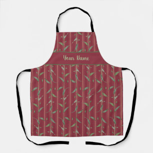 Branch of leaves on red wallpaper apron
