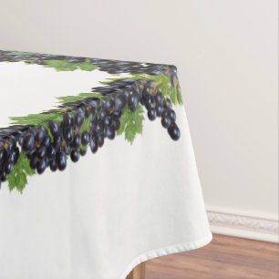 Branches of Red Wine Grapes on White Tablecloth