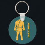 Brazilian Jiu Jitsu BJJ Gi Teal Personalized Keychain<br><div class="desc">Create a personalized gift that's perfect for Brazilian Jiu Jitsu or BJJ students and instructors. This keychain features an illustration of a BJJ gi or uniform in golden yellow against a teal coloured background. It's ready to be personalized with a name in matching yellow lettering beside the graphic.</div>