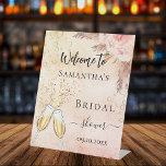 Bridal Shower bubbly brunch rose florals welcome Pedestal Sign<br><div class="desc">For a Bridal Shower.  A rose gold and pink rustic gradient background,  pink flowers and pampas grass. Bubbles and a pair of flutes.    Personalize and add a name.</div>