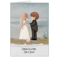 bride and groom on beach sand with specific name