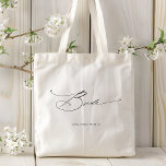 Bride Modern Elegant Script Wedding Custom Name Tote Bag<br><div class="desc">Bride Modern Elegant Script Typography Wedding Custom Name Tote Bag features the simple text "Bride" in an elegant modern black calligraphy script typography. Personalized with your custom name and wedding date. Perfect for the bride for a bridal shower or wedding day. Designed by Evco Studio www.zazzle.com/store/evcostudio</div>