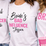 Bride’s Bad Influence Custom Bachelorette Party T-Shirt<br><div class="desc">Make a statement at the bachelorette party with this fun and cheeky “Bride’s Bad Influence” bridal party shirt. Perfect for the crew that keeps the celebration going, this design blends bold lettering with a stylish script font and a personalized name for that extra custom flair. Whether you’re hitting the town...</div>