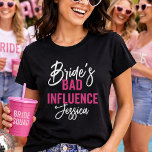 Bride’s Bad Influence Custom Bachelorette Party T-Shirt<br><div class="desc">Make a statement at the bachelorette party with this fun and cheeky “Bride’s Bad Influence” bridal party shirt. Perfect for the crew that keeps the celebration going, this design blends bold lettering with a stylish script font and a personalized name for that extra custom flair. Whether you’re hitting the town...</div>