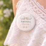 Bride to be ivory bow pearls elegant Bachelorette 2 Inch Round Button<br><div class="desc">Celebrate your special milestone with this chic bachelorette party button. The design features a luxurious ivory bow adorned with delicate pearl strands and sophisticated gold-toned script. It serves as a stylish accessory for the bride-to-be to wear during her bridal shower or night out with bridesmaids. Ivory background color.</div>