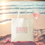Bride Tote Bag | Personalized Future Mrs. Name<br><div class="desc">This elegant personalized “Bride” tote bag is the perfect accessory for any bride-to-be! Featuring bold blush pink “BRIDE” lettering and customizable “future Mrs. [Name]” script underneath, it's a chic and practical gift for bridal showers, bachelorette weekends, or wedding day essentials. Lightweight and reusable, this bridal tote fits everything from makeup...</div>